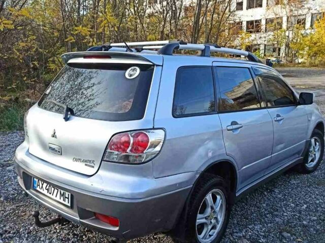 Серый Мицубиси Аутлендер, объемом двигателя 2.4 л и пробегом 317 тыс. км за 5200 $, фото 2 на Automoto.ua