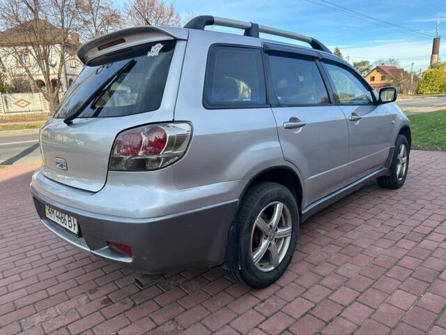 Серый Мицубиси Аутлендер, объемом двигателя 2.4 л и пробегом 221 тыс. км за 5550 $, фото 5 на Automoto.ua