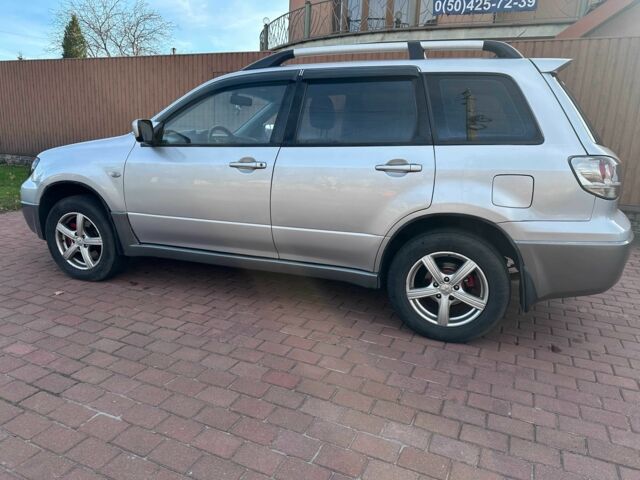 Серый Мицубиси Аутлендер, объемом двигателя 2.4 л и пробегом 221 тыс. км за 5550 $, фото 8 на Automoto.ua