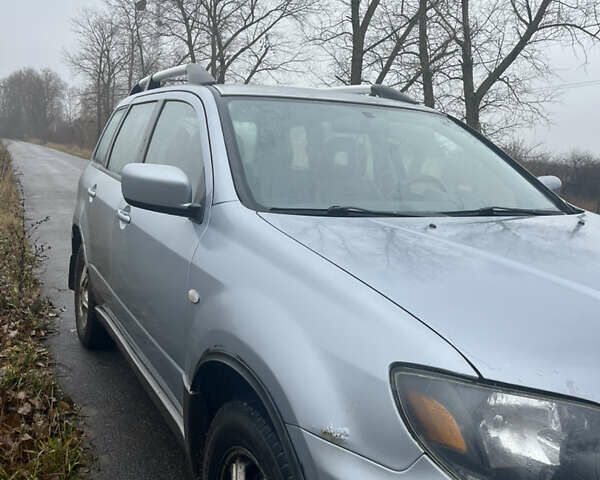 Серый Мицубиси Аутлендер, объемом двигателя 2.38 л и пробегом 432 тыс. км за 4700 $, фото 2 на Automoto.ua