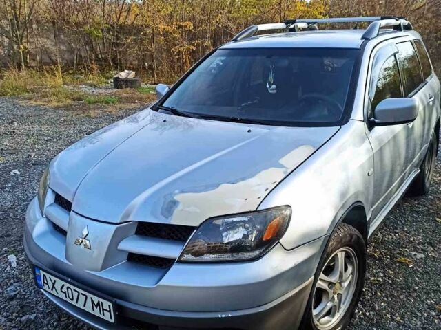 Серый Мицубиси Аутлендер, объемом двигателя 2.4 л и пробегом 317 тыс. км за 5200 $, фото 1 на Automoto.ua