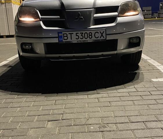 Серый Мицубиси Аутлендер, объемом двигателя 2.4 л и пробегом 285 тыс. км за 4600 $, фото 4 на Automoto.ua