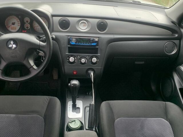 Серый Мицубиси Аутлендер, объемом двигателя 2.4 л и пробегом 229 тыс. км за 4850 $, фото 6 на Automoto.ua