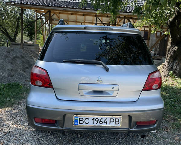 Сірий Міцубісі Аутлендер, об'ємом двигуна 2 л та пробігом 371 тис. км за 6850 $, фото 48 на Automoto.ua