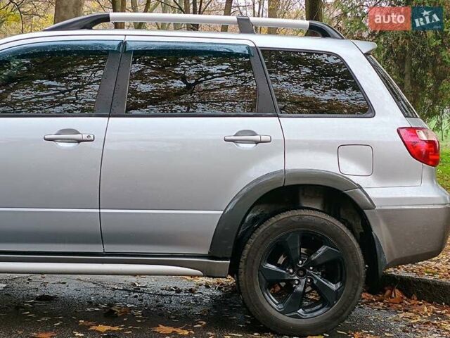 Серый Мицубиси Аутлендер, объемом двигателя 2.38 л и пробегом 266 тыс. км за 6399 $, фото 3 на Automoto.ua