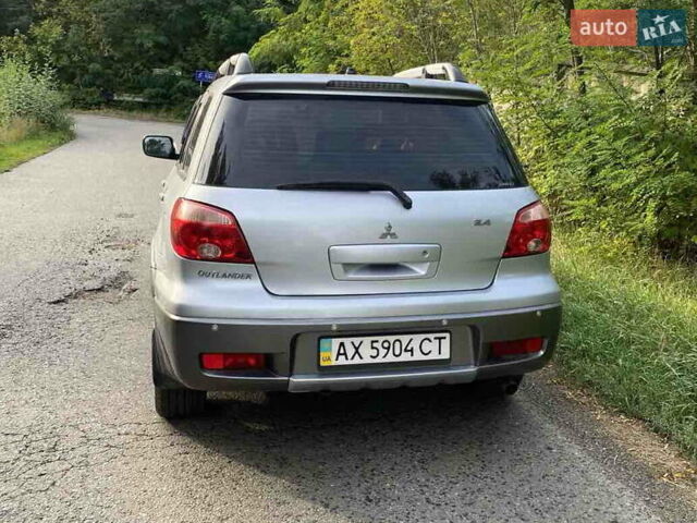 Сірий Міцубісі Аутлендер, об'ємом двигуна 2.38 л та пробігом 232 тис. км за 6000 $, фото 7 на Automoto.ua
