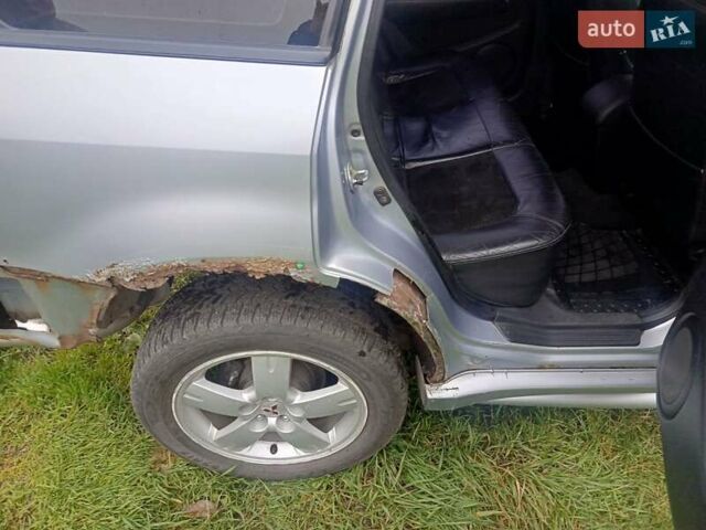 Сірий Міцубісі Аутлендер, об'ємом двигуна 2 л та пробігом 230 тис. км за 5200 $, фото 11 на Automoto.ua