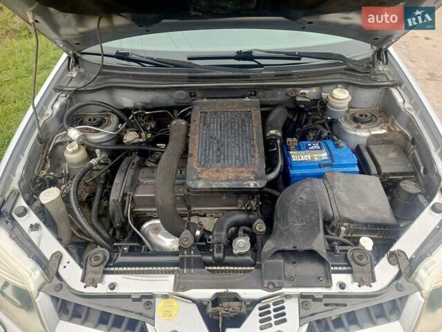 Сірий Міцубісі Аутлендер, об'ємом двигуна 2 л та пробігом 230 тис. км за 5200 $, фото 18 на Automoto.ua