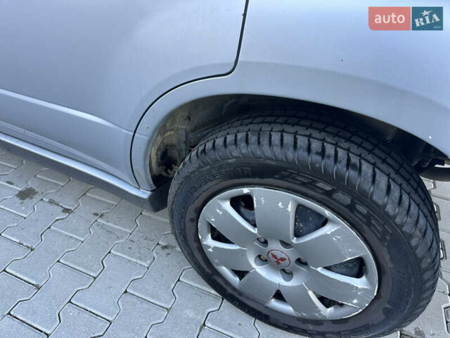 Серый Мицубиси Аутлендер, объемом двигателя 2 л и пробегом 220 тыс. км за 4550 $, фото 11 на Automoto.ua