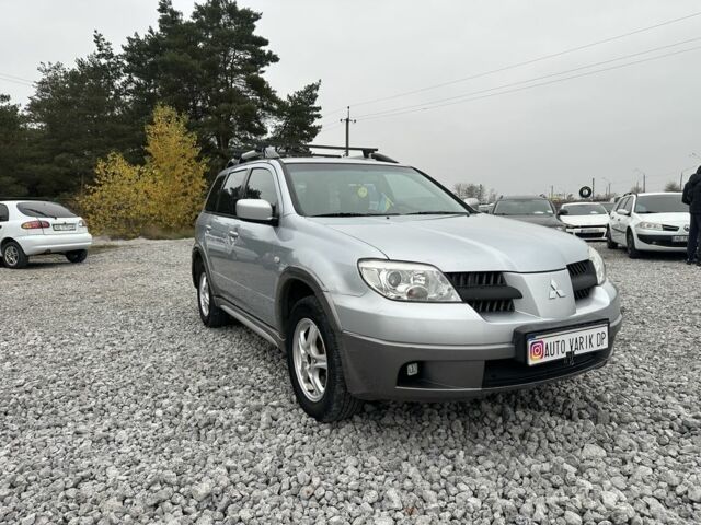 Серый Мицубиси Аутлендер, объемом двигателя 2.4 л и пробегом 260 тыс. км за 5750 $, фото 2 на Automoto.ua