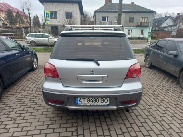 Серый Мицубиси Аутлендер, объемом двигателя 2.4 л и пробегом 246 тыс. км за 5500 $, фото 3 на Automoto.ua