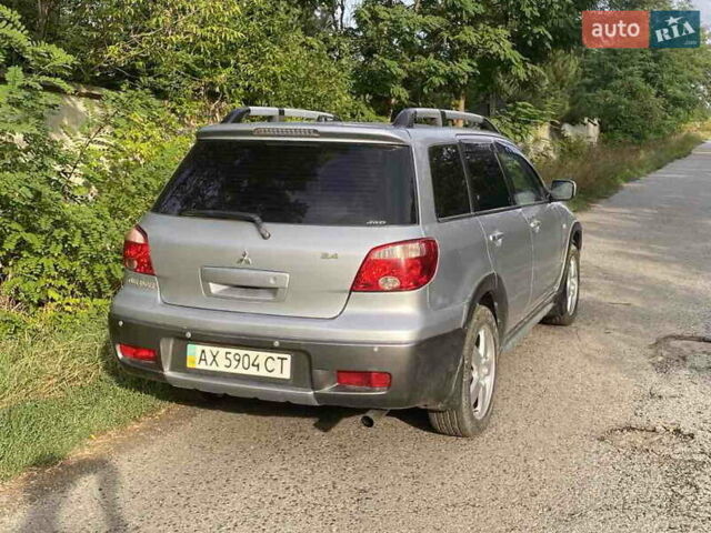 Сірий Міцубісі Аутлендер, об'ємом двигуна 2.38 л та пробігом 232 тис. км за 6000 $, фото 8 на Automoto.ua