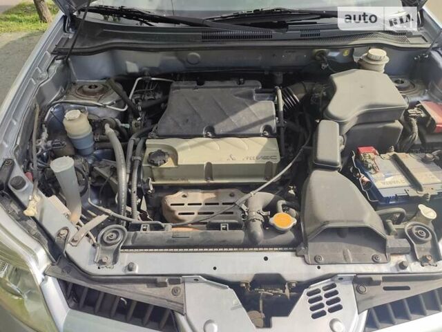 Сірий Міцубісі Аутлендер, об'ємом двигуна 2.4 л та пробігом 195 тис. км за 6900 $, фото 14 на Automoto.ua
