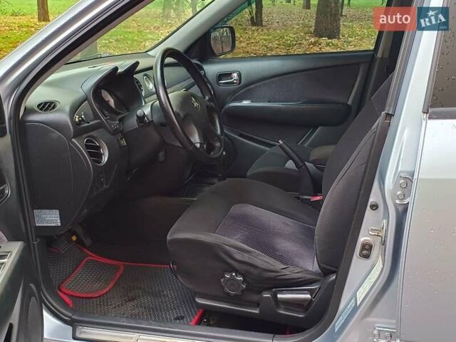 Серый Мицубиси Аутлендер, объемом двигателя 2.38 л и пробегом 266 тыс. км за 6399 $, фото 18 на Automoto.ua