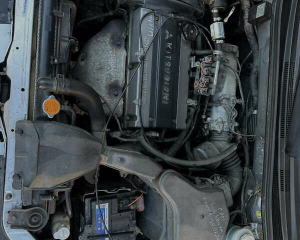 Серый Мицубиси Аутлендер, объемом двигателя 2 л и пробегом 316 тыс. км за 6500 $, фото 8 на Automoto.ua