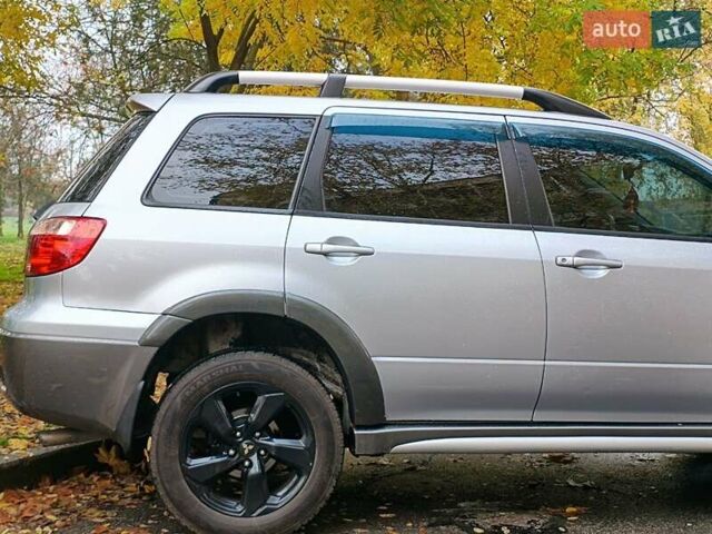 Серый Мицубиси Аутлендер, объемом двигателя 2.38 л и пробегом 266 тыс. км за 6399 $, фото 7 на Automoto.ua