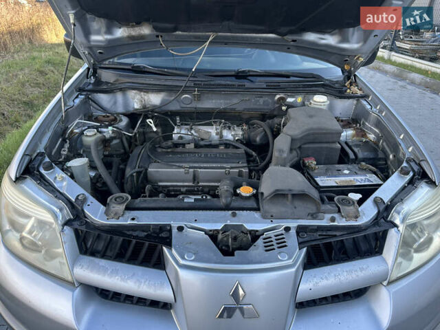 Серый Мицубиси Аутлендер, объемом двигателя 2 л и пробегом 220 тыс. км за 4550 $, фото 26 на Automoto.ua