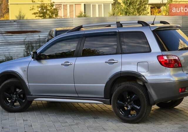 Сірий Міцубісі Аутлендер, об'ємом двигуна 2.4 л та пробігом 259 тис. км за 5999 $, фото 12 на Automoto.ua