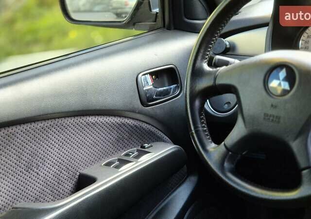 Сірий Міцубісі Аутлендер, об'ємом двигуна 2.4 л та пробігом 259 тис. км за 5999 $, фото 21 на Automoto.ua