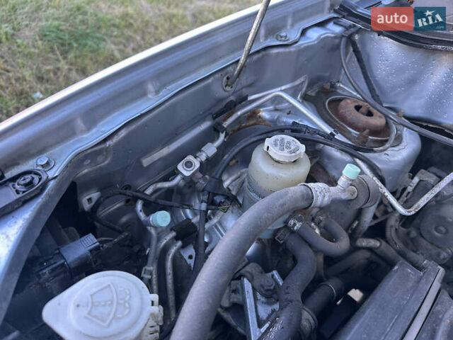 Серый Мицубиси Аутлендер, объемом двигателя 2 л и пробегом 220 тыс. км за 4550 $, фото 28 на Automoto.ua