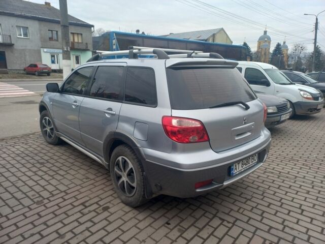 Серый Мицубиси Аутлендер, объемом двигателя 2.4 л и пробегом 246 тыс. км за 5500 $, фото 5 на Automoto.ua