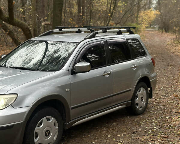 Сірий Міцубісі Аутлендер, об'ємом двигуна 2.38 л та пробігом 303 тис. км за 5200 $, фото 1 на Automoto.ua