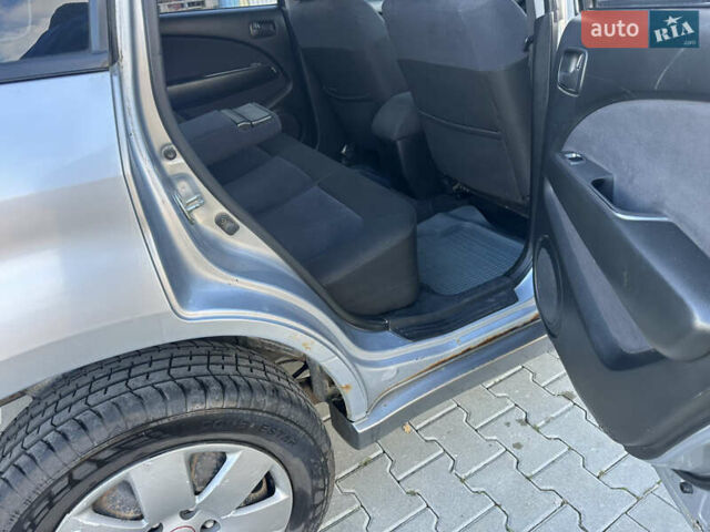 Серый Мицубиси Аутлендер, объемом двигателя 2 л и пробегом 220 тыс. км за 4550 $, фото 9 на Automoto.ua