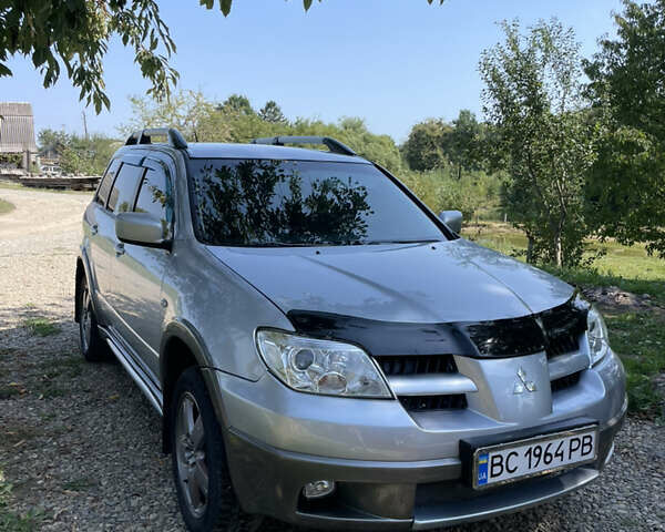 Сірий Міцубісі Аутлендер, об'ємом двигуна 2 л та пробігом 371 тис. км за 6850 $, фото 45 на Automoto.ua