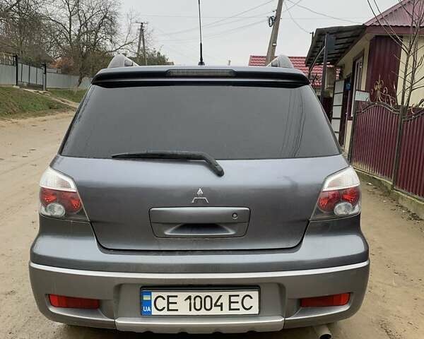 Сірий Міцубісі Аутлендер, об'ємом двигуна 2.4 л та пробігом 230 тис. км за 5927 $, фото 1 на Automoto.ua