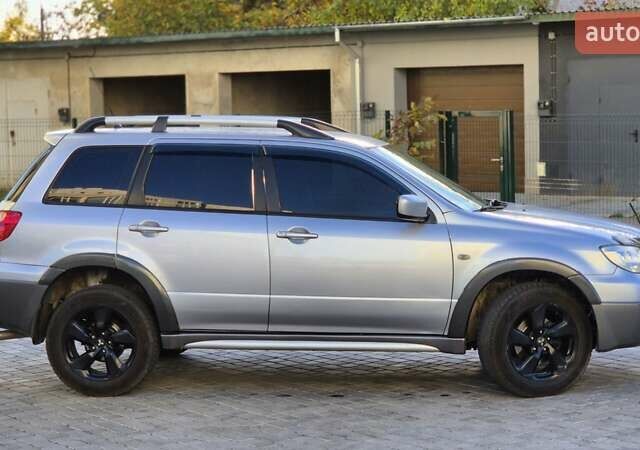 Сірий Міцубісі Аутлендер, об'ємом двигуна 2.4 л та пробігом 259 тис. км за 5999 $, фото 1 на Automoto.ua