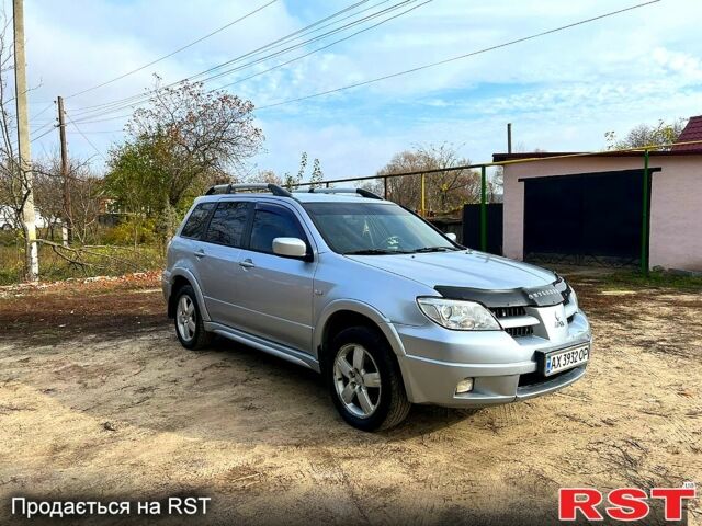 Серый Мицубиси Аутлендер, объемом двигателя 2 л и пробегом 200 тыс. км за 5700 $, фото 6 на Automoto.ua