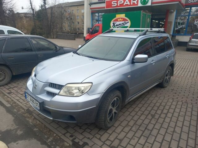 Серый Мицубиси Аутлендер, объемом двигателя 2.4 л и пробегом 246 тыс. км за 5500 $, фото 1 на Automoto.ua