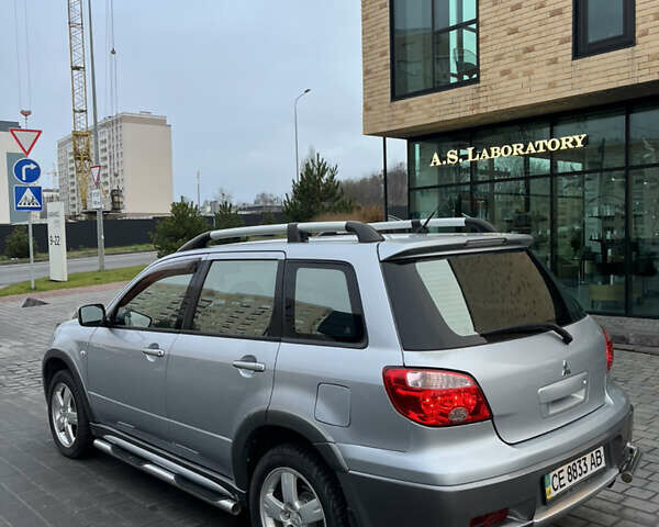 Серый Мицубиси Аутлендер, объемом двигателя 2.38 л и пробегом 180 тыс. км за 6000 $, фото 5 на Automoto.ua