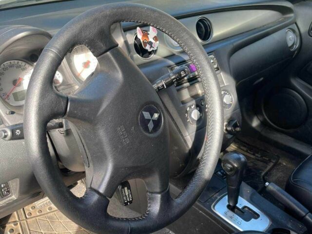 Серый Мицубиси Аутлендер, объемом двигателя 2.4 л и пробегом 127 тыс. км за 4400 $, фото 6 на Automoto.ua