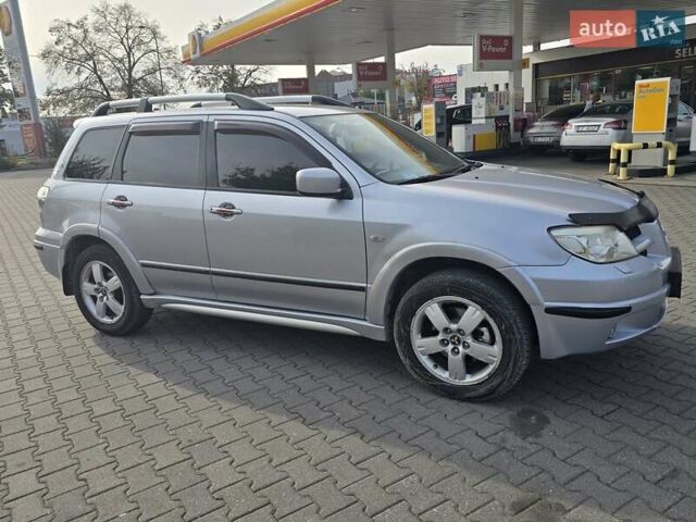 Серый Мицубиси Аутлендер, объемом двигателя 2.4 л и пробегом 243 тыс. км за 6999 $, фото 21 на Automoto.ua
