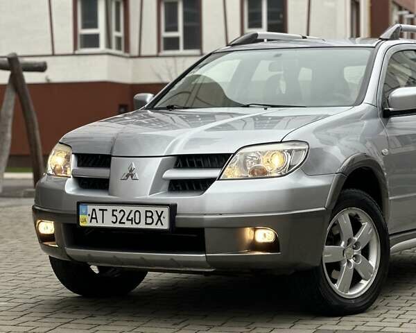 Сірий Міцубісі Аутлендер, об'ємом двигуна 2.4 л та пробігом 98 тис. км за 7199 $, фото 8 на Automoto.ua