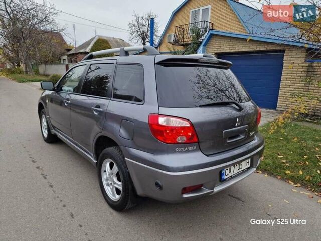 Серый Мицубиси Аутлендер, объемом двигателя 2 л и пробегом 240 тыс. км за 6300 $, фото 6 на Automoto.ua