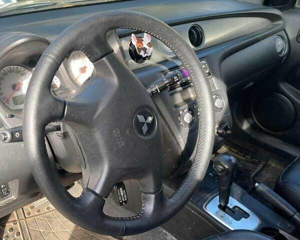 Серый Мицубиси Аутлендер, объемом двигателя 2.4 л и пробегом 127 тыс. км за 4400 $, фото 5 на Automoto.ua