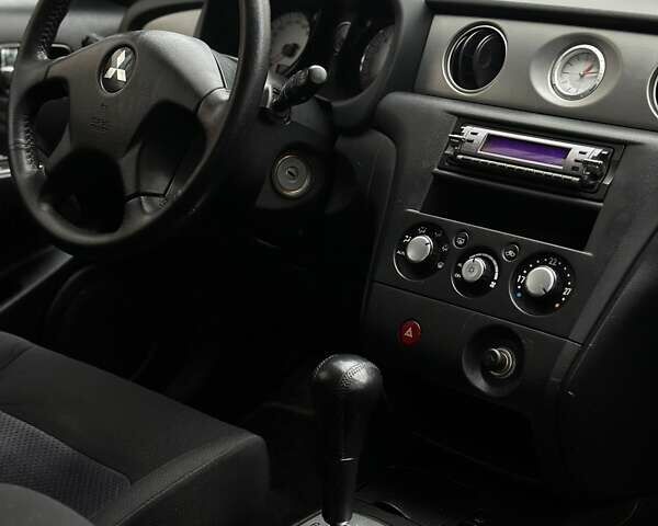 Сірий Міцубісі Аутлендер, об'ємом двигуна 2.4 л та пробігом 98 тис. км за 7199 $, фото 79 на Automoto.ua