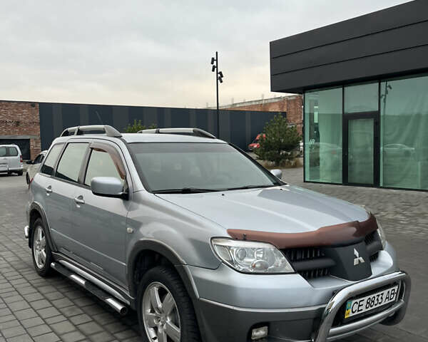Серый Мицубиси Аутлендер, объемом двигателя 2.38 л и пробегом 180 тыс. км за 6000 $, фото 6 на Automoto.ua