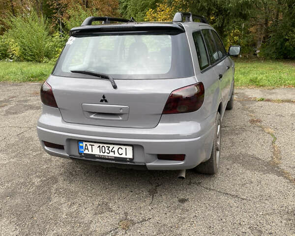 Сірий Міцубісі Аутлендер, об'ємом двигуна 2 л та пробігом 480 тис. км за 5600 $, фото 4 на Automoto.ua
