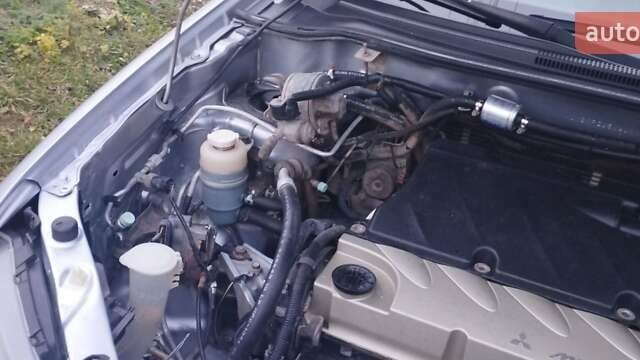 Серый Мицубиси Аутлендер, объемом двигателя 2.4 л и пробегом 261 тыс. км за 5700 $, фото 9 на Automoto.ua