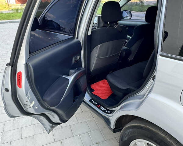 Серый Мицубиси Аутлендер, объемом двигателя 2 л и пробегом 179 тыс. км за 9500 $, фото 9 на Automoto.ua