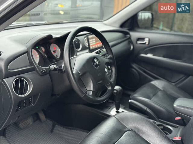 Серый Мицубиси Аутлендер, объемом двигателя 2.38 л и пробегом 204 тыс. км за 6990 $, фото 5 на Automoto.ua