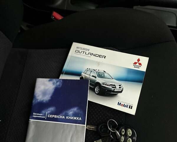 Сірий Міцубісі Аутлендер, об'ємом двигуна 2.4 л та пробігом 98 тис. км за 7199 $, фото 96 на Automoto.ua