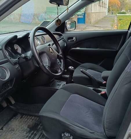 Сірий Міцубісі Аутлендер, об'ємом двигуна 2 л та пробігом 312 тис. км за 8300 $, фото 13 на Automoto.ua