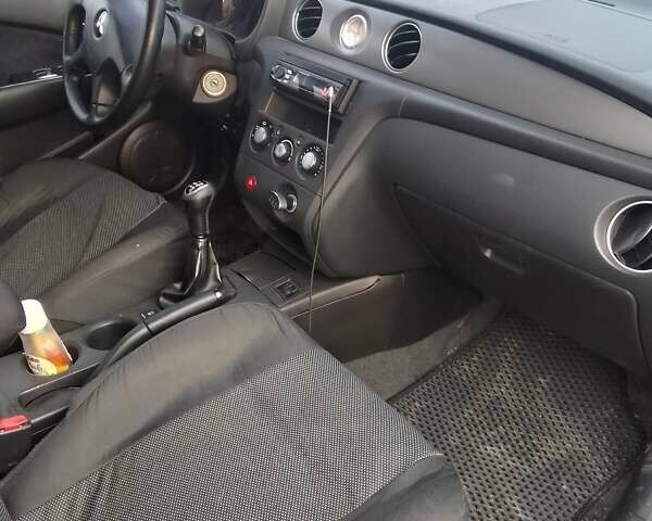 Серый Мицубиси Аутлендер, объемом двигателя 2 л и пробегом 154 тыс. км за 6500 $, фото 6 на Automoto.ua