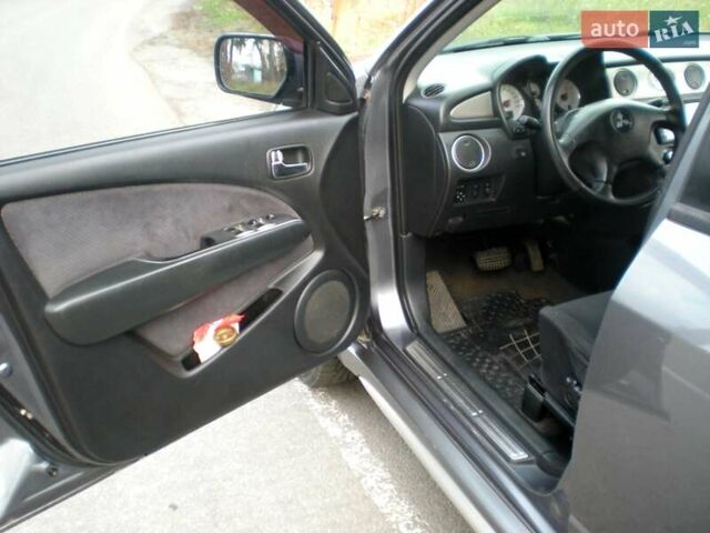 Серый Мицубиси Аутлендер, объемом двигателя 2.4 л и пробегом 235 тыс. км за 6500 $, фото 12 на Automoto.ua