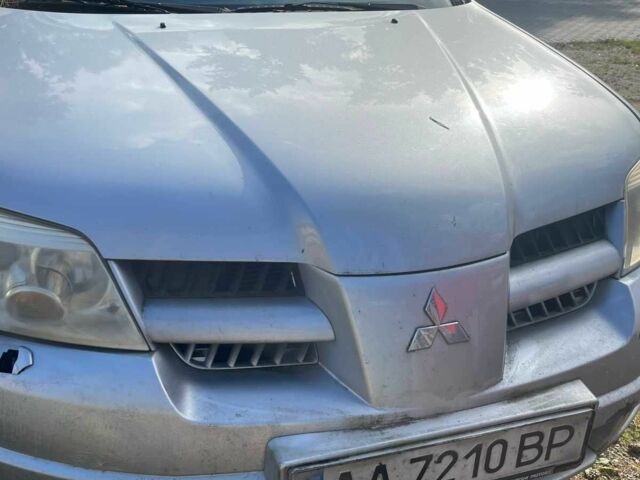 Серый Мицубиси Аутлендер, объемом двигателя 2.4 л и пробегом 127 тыс. км за 4400 $, фото 1 на Automoto.ua