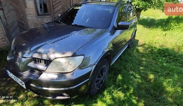 Сірий Міцубісі Аутлендер, об'ємом двигуна 2.38 л та пробігом 204 тис. км за 6500 $, фото 6 на Automoto.ua